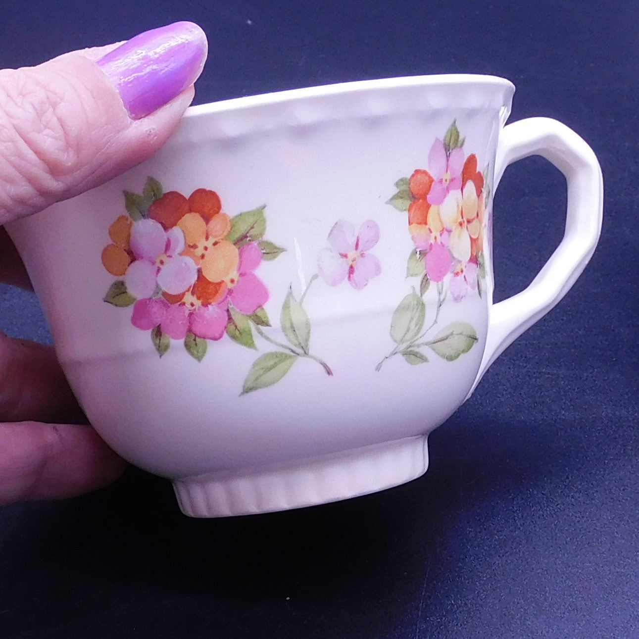 Embrace Elegance: Elevate Your Tea Time with a Teacup Adorned in Vibrant Jumping Jack Flowers (7179)