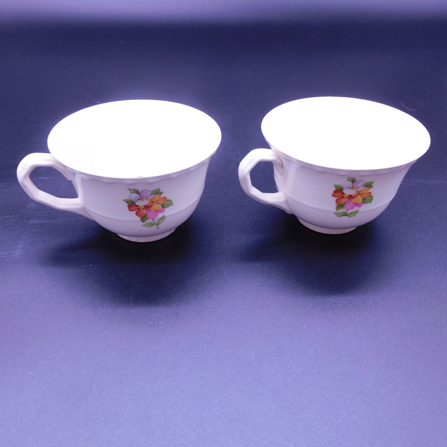 Embrace Elegance: Elevate Your Tea Time with a Teacup Adorned in Vibrant Jumping Jack Flowers (7179)